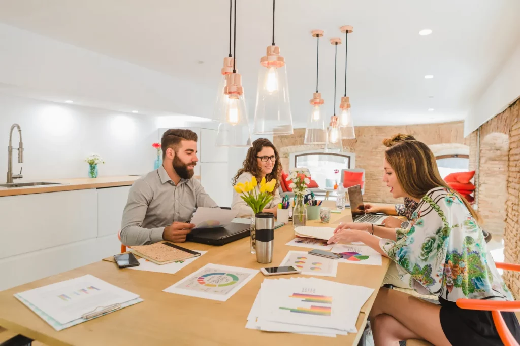 Team collaborating in modern office with documents.