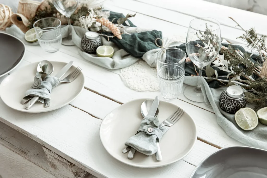 Rustic table setting with greenery and candles